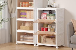 stackable storage bins with items in a room