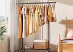 clothes on a rack in a room