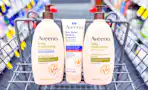 three aveeno body lotions in a cvs shopping cart