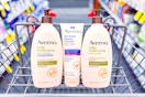 three aveeno body lotions in a cvs shopping cart