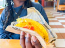 Holding a taco from Del Taco
