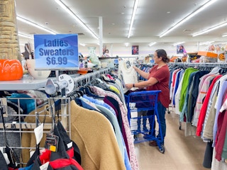 a woman shopping in the woman clothing aisles