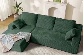 Lifestyle image of the green cloud sofa from Walmart