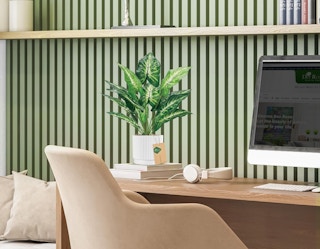 a artificial plant on a desk in a room