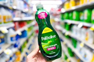 hand holding a bottle of palmolive dish soap