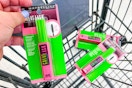 hand placing mascara into shopping cart with two other mascaras