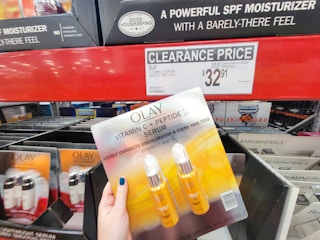 hand holding a 2-pack of olay vitamin c serums