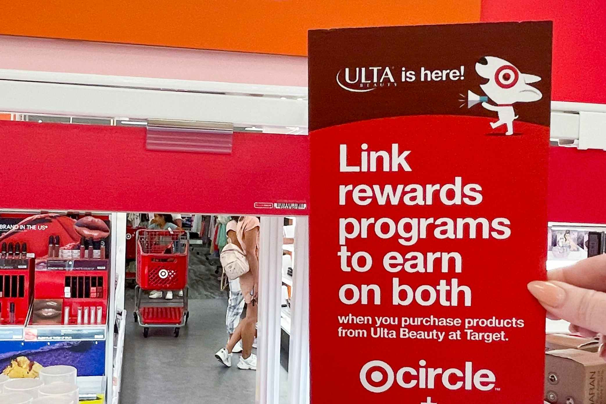 a target and ulta rewards flyer on shelf of ulta inside target
