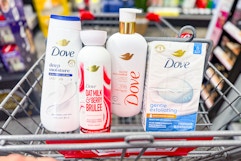 dove body wash and bar soaps in a cart