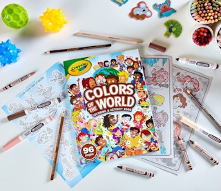 Image of a coloring book and markers on a table