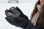 a woman holding hand warmers