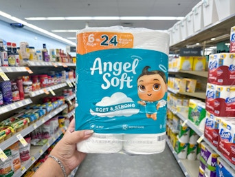 hand holding angel soft toilet paper in walgreens