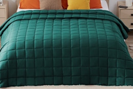 yescool Weighted Blanket Dark Green on a made bed.