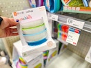 hand holding a munchin stay put bowl set at target