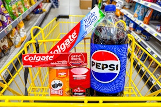 pepsi, colgate, pringles, old spice products in a yellow shopping cart