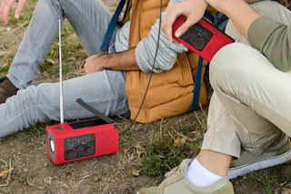people outside with headphones listening to radio