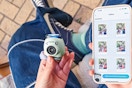 Lifestyle image of Instax Pul Camera held near an iPhone using the Instax app