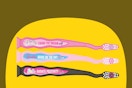 a set of barbie firefly kids toothbrushes