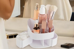 a rotating makeup organizer on a table