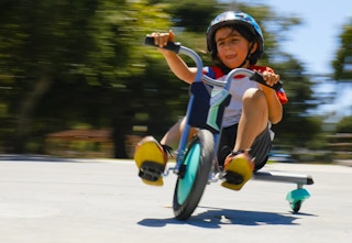child on a Razor RipRider