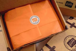 an open shipping box from unclaimed baggage
