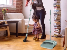 a person sweeping in a room 