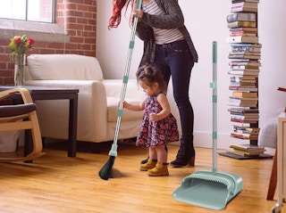 a person sweeping in a room 