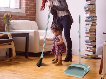 a person sweeping in a room 