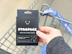 Starface Hydro Acne Patches (32 count) in black held over Walmart shopping cart