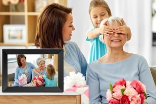 a family near a digital picture frame