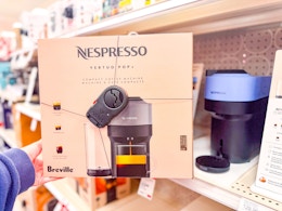 hand holding a nespresso coffee and espresso maker at target