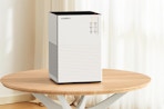 an air purifier on a wooden table