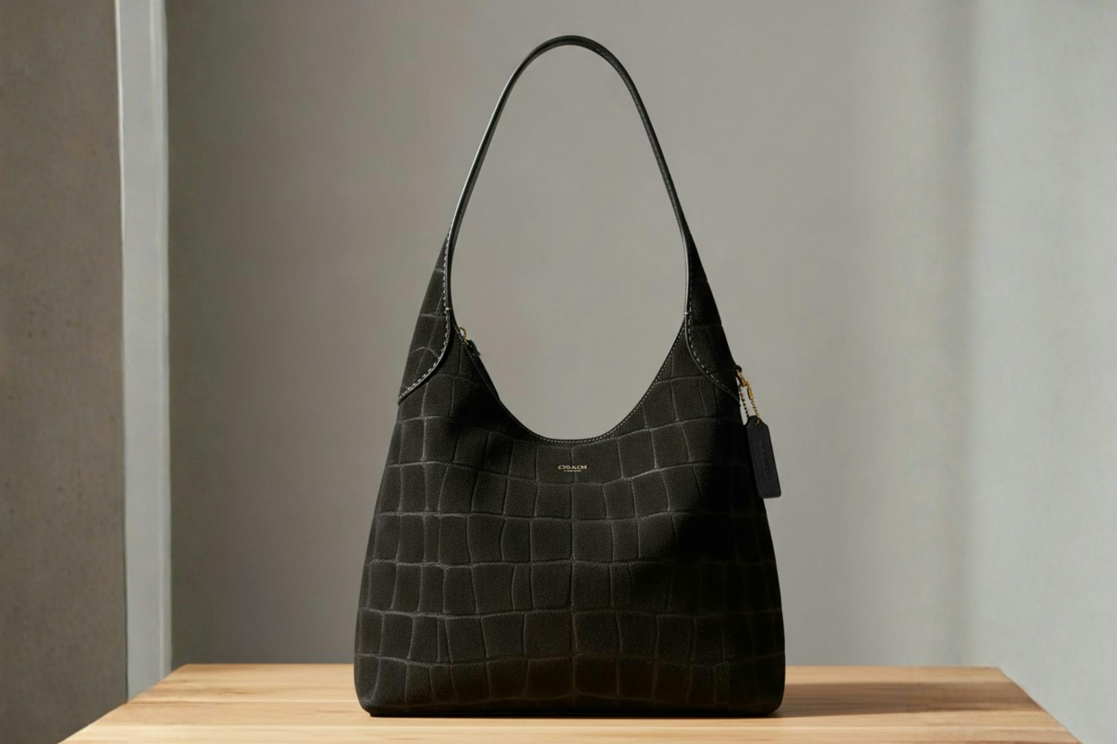 a coach bag in three different colors 