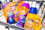 three arm and hammer laundry products in a shopping cart