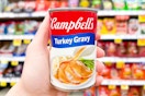 hand holding a can of campbells gravy