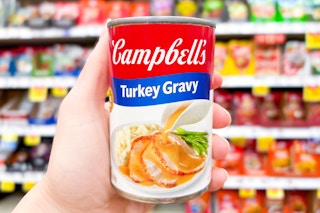 hand holding a can of campbells gravy