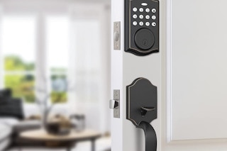 A keypad on a white door