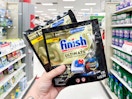 hand holding finish ultimate dishwasher tabs pack in a target aisle
