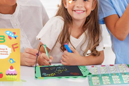 child using writing tablet