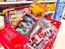 4 maxx action toys sitting in a target cart