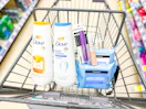 neutrogena, dove, and covergirl products in a walgreens cart
