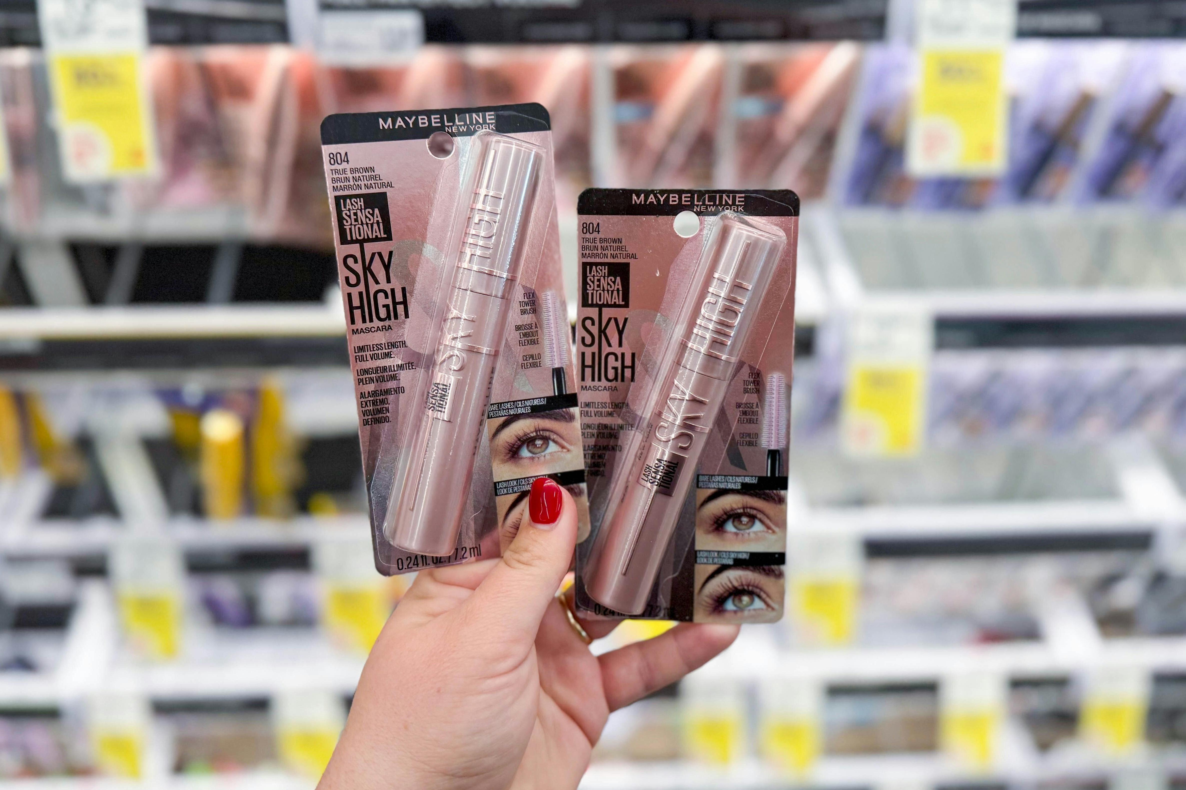 hand holding two maybelline sky high mascaras