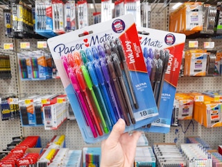 Two 18-count Paper Mate Inkjoy Pen products held in office and school supply aisle at Walmart