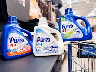 two bottles of purex detergent on counter with one bottle on walmart cart