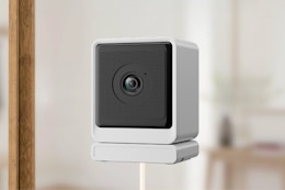 STSVA 3MP 2K Window Security Camera hanging from a window.