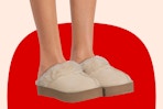Close up shot of model wearing the Joyspun Women's Faux Suede Platform Clog Slippers in the color "oatmeal" 