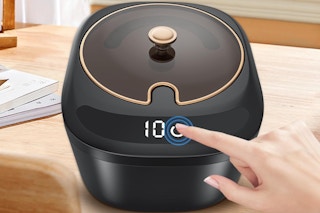 a black electric retainer cleaner on a table