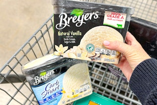 hand holding breyers ice cream and breyers ice cream in shopping cart