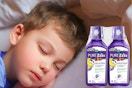 A child sleeps next to two bottles of Vicks Pure Zzzs.