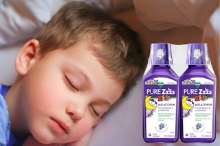 A child sleeps next to two bottles of Vicks Pure Zzzs.